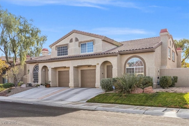 mediterranean / spanish-style home featuring a garage