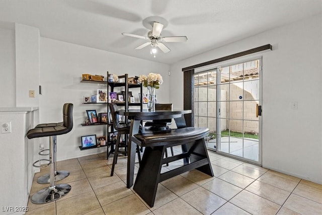 dining room with ceiling fan and light tile patterned flooring