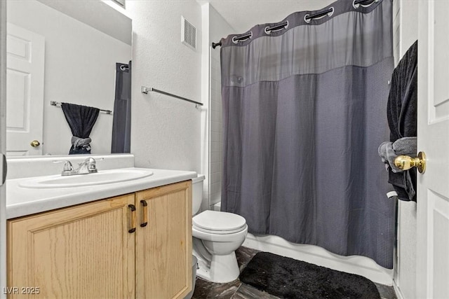 full bathroom with toilet, vanity, and shower / tub combo with curtain