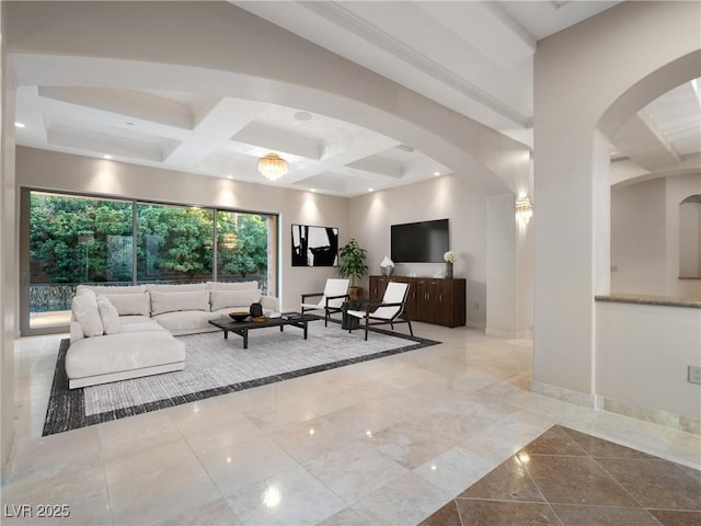 living room with beamed ceiling and coffered ceiling