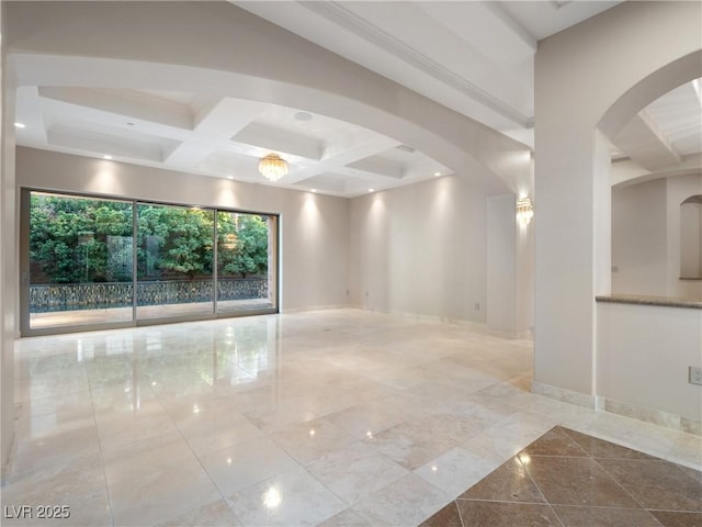 empty room featuring beam ceiling and coffered ceiling