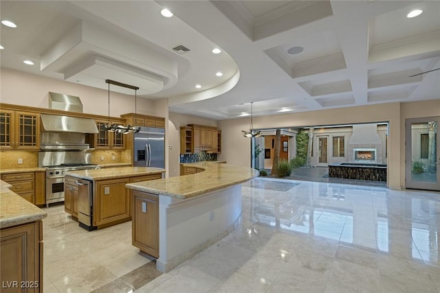 kitchen with pendant lighting, backsplash, a spacious island, range hood, and stainless steel appliances