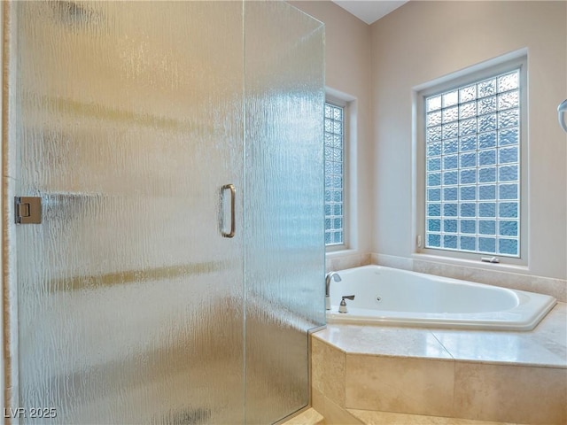 bathroom with shower with separate bathtub