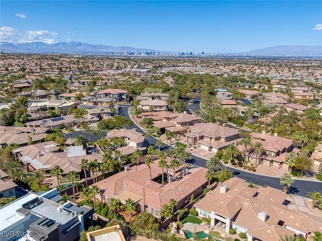 birds eye view of property featuring a mountain view