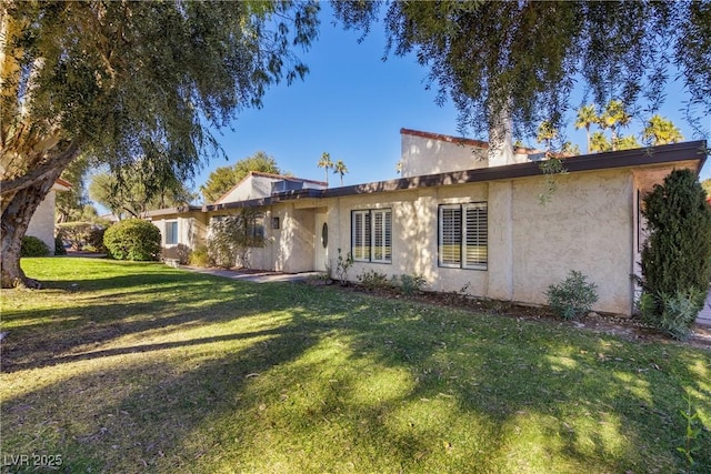 exterior space featuring a front lawn