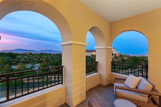 balcony at dusk with a mountain view