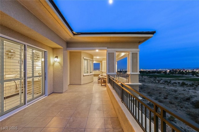 view of balcony at dusk