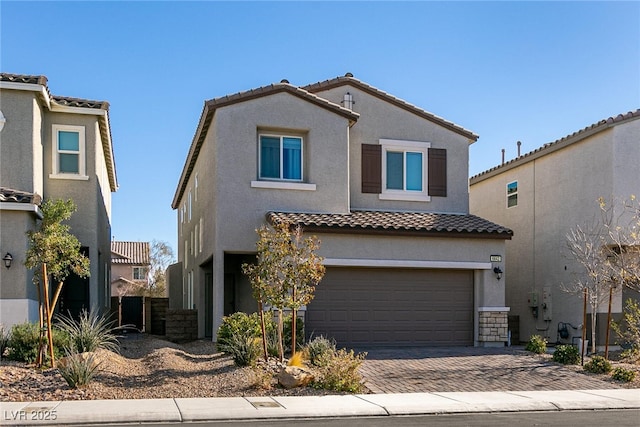 mediterranean / spanish-style home featuring a garage