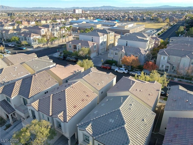 birds eye view of property with a mountain view