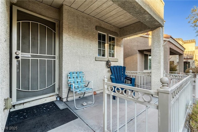 entrance to property featuring covered porch