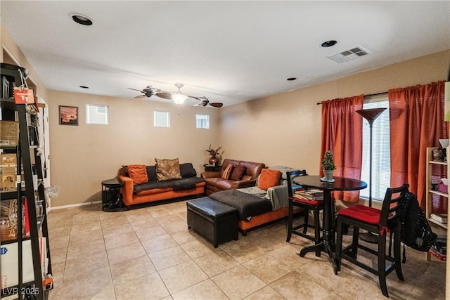 living room featuring ceiling fan and light tile patterned flooring