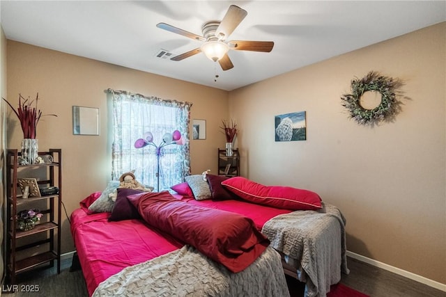 bedroom featuring ceiling fan and dark hardwood / wood-style flooring