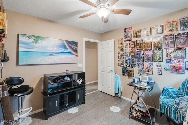 home office with ceiling fan and hardwood / wood-style floors