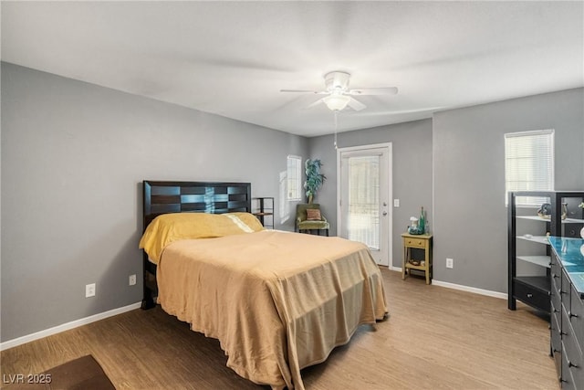 bedroom with access to outside, light hardwood / wood-style flooring, and ceiling fan