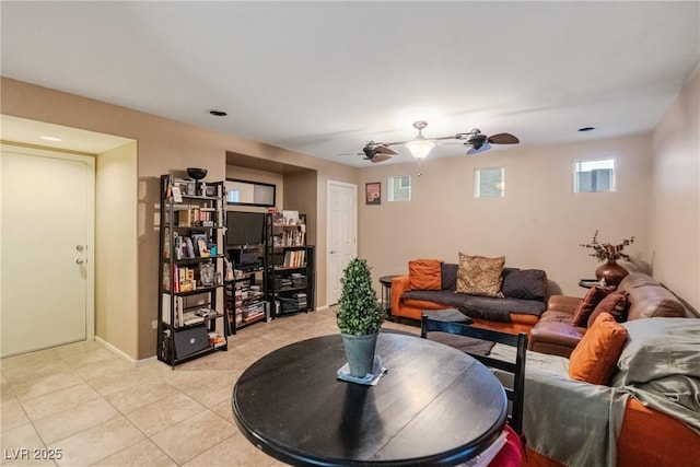 living room featuring light tile patterned floors and ceiling fan