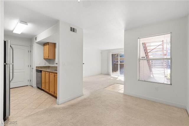 kitchen featuring light colored carpet and appliances with stainless steel finishes