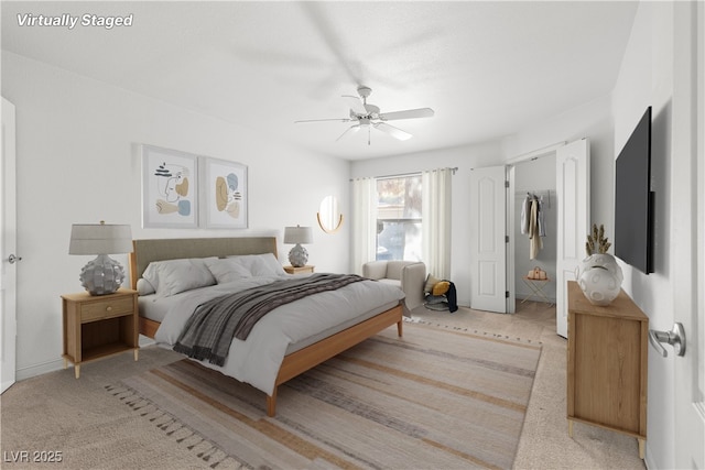 bedroom featuring ceiling fan and light colored carpet