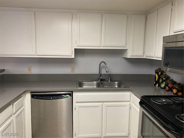 kitchen featuring white cabinetry, sink, and stainless steel appliances