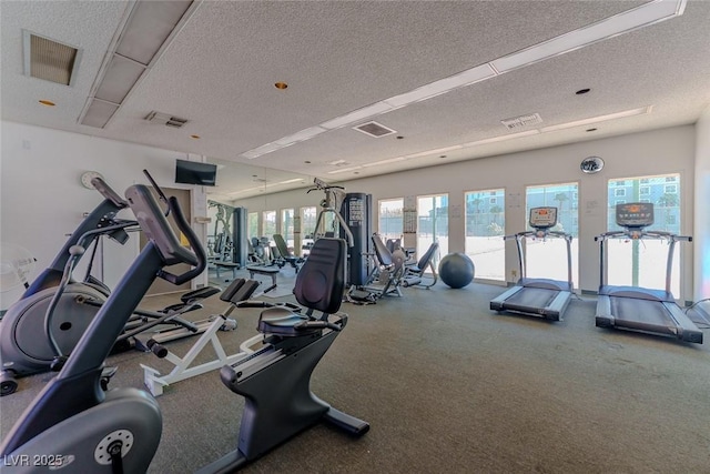 workout area featuring a textured ceiling