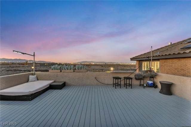 wooden deck featuring area for grilling