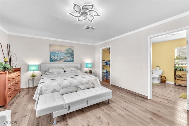 bedroom with crown molding, baseboards, visible vents, and light wood-style floors