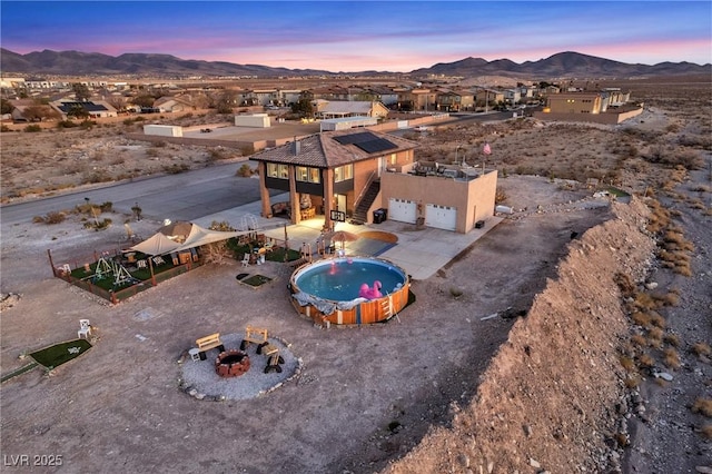 aerial view at dusk with a mountain view