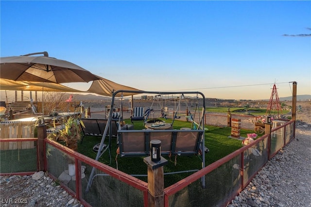 view of yard at dusk