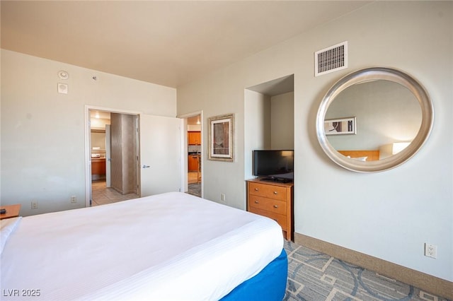 bedroom with light colored carpet