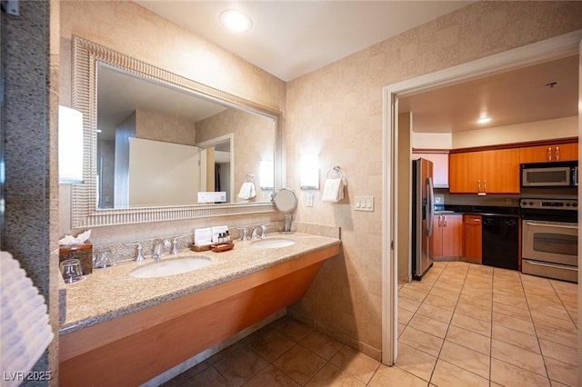 bathroom featuring tile patterned flooring and vanity