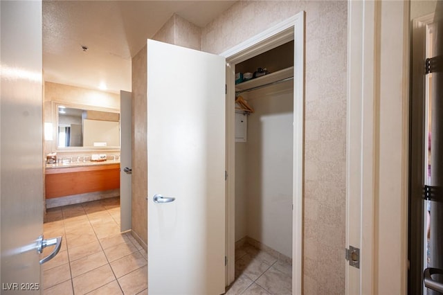 bathroom with tile patterned flooring and vanity