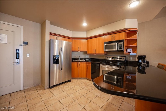 kitchen featuring light tile patterned flooring, sink, and stainless steel appliances