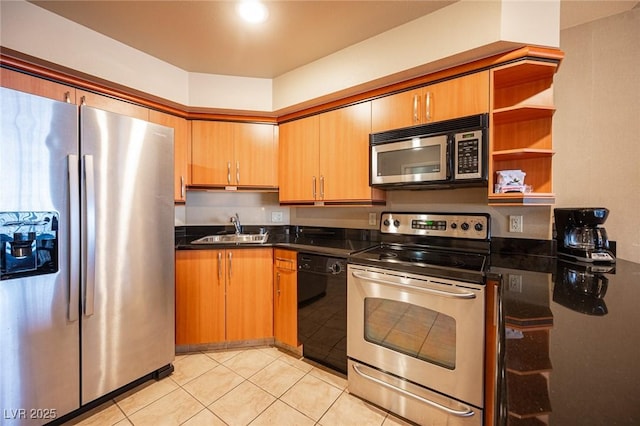 kitchen featuring light tile patterned floors, stainless steel appliances, and sink