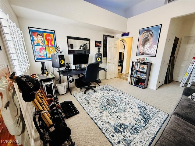 carpeted home office with plenty of natural light