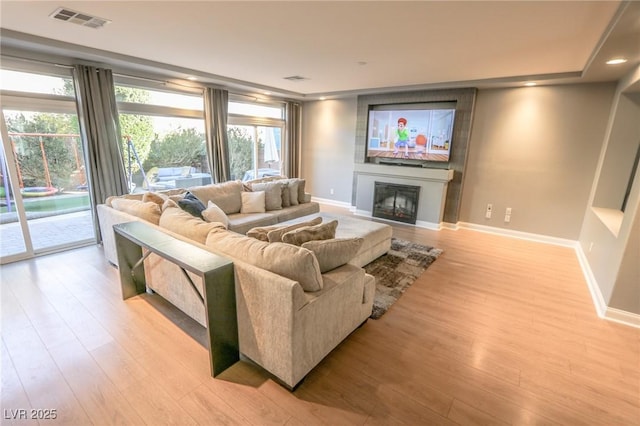 living room with light hardwood / wood-style flooring