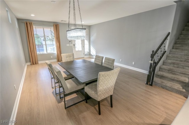 dining room with light wood-type flooring