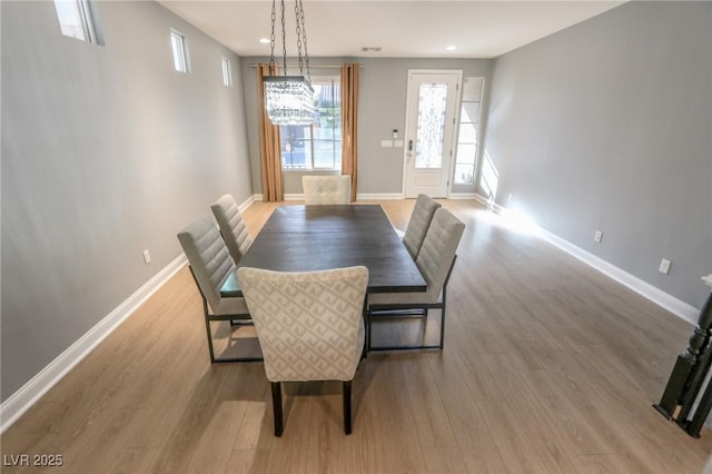 dining room with light hardwood / wood-style flooring