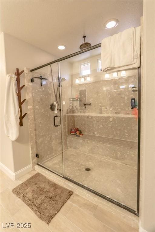 bathroom with tile patterned floors and an enclosed shower