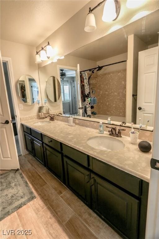 bathroom featuring vanity and shower / tub combo with curtain