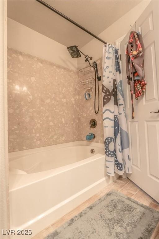 bathroom with tile patterned flooring and shower / bath combo