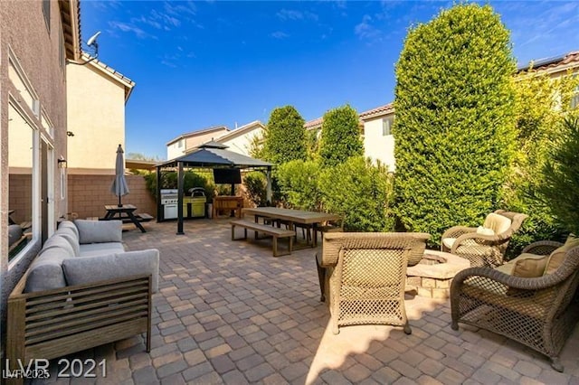 view of patio with a gazebo, an outdoor hangout area, and area for grilling