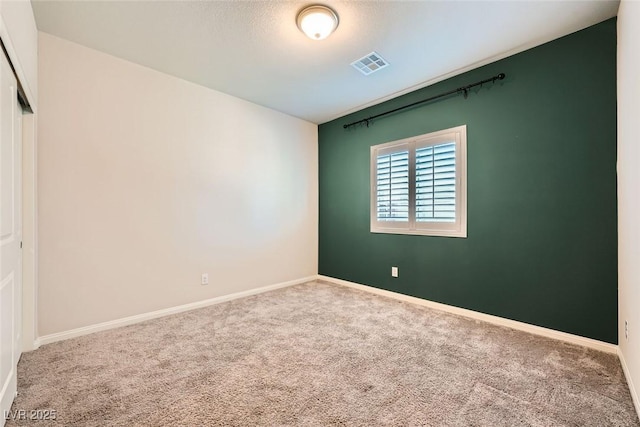 empty room featuring carpet