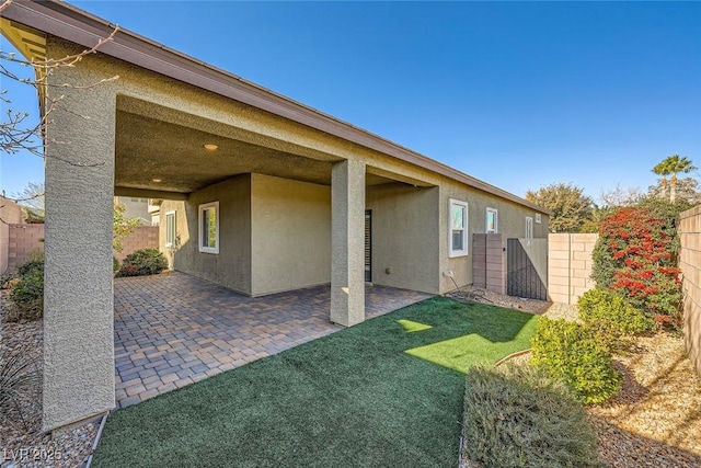 rear view of property with a patio area