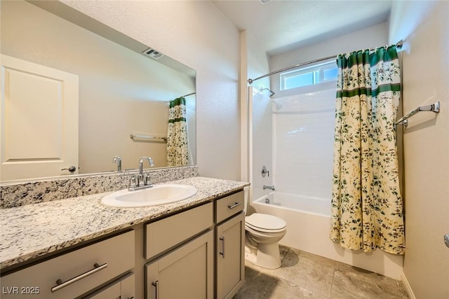 full bathroom with toilet, vanity, and shower / bath combo with shower curtain