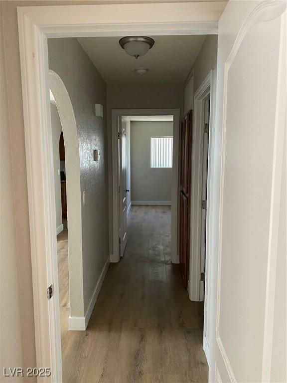 corridor with light hardwood / wood-style flooring