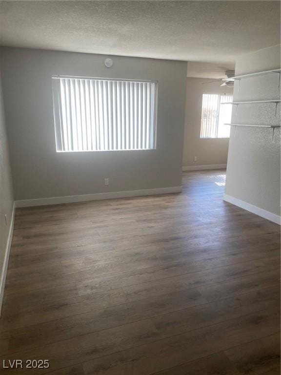 unfurnished room featuring dark hardwood / wood-style flooring