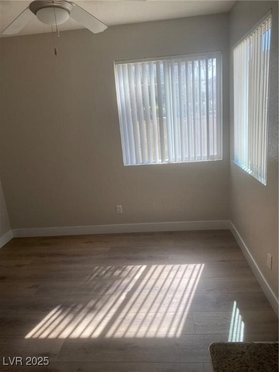 empty room featuring hardwood / wood-style floors and ceiling fan