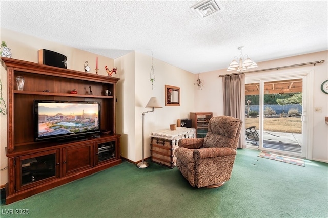 living area featuring a chandelier, a textured ceiling, and dark carpet