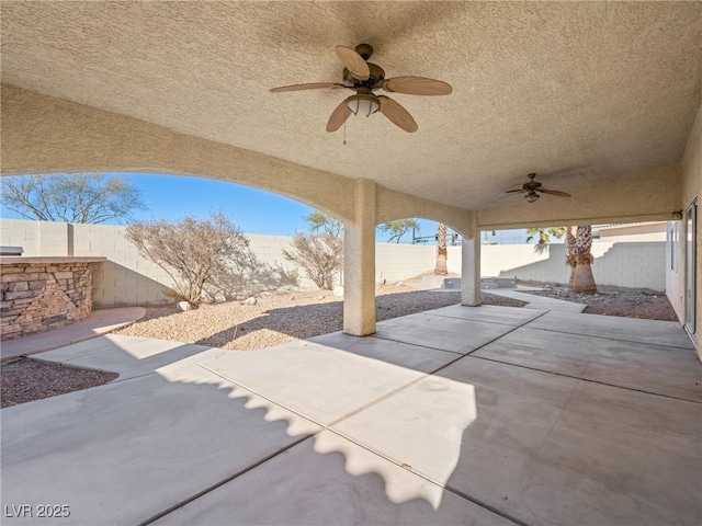 view of patio featuring ceiling fan