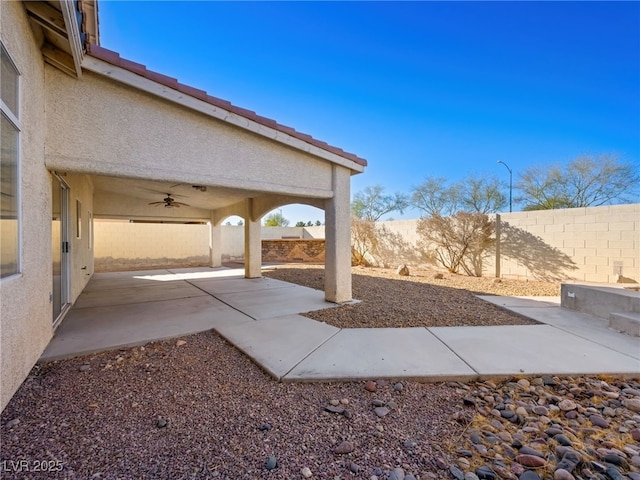 view of patio featuring ceiling fan