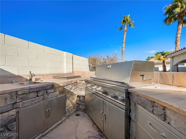 view of patio / terrace with grilling area and exterior kitchen